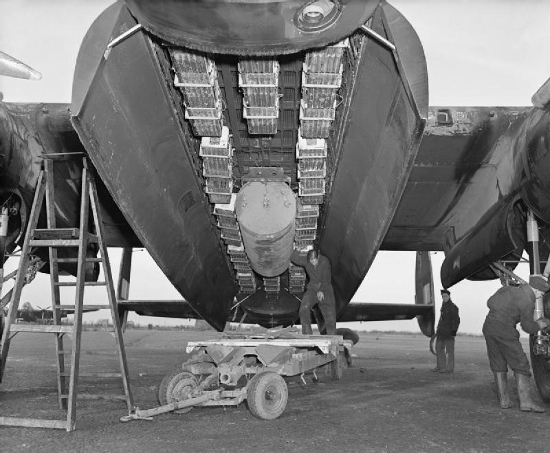 A 57 Squadron Lancaster with area bombing load of a 4000-pound blast bomb and incendiary bombs.